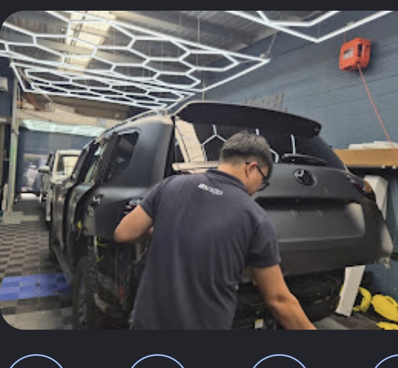 AV Tint & Protect technician working on a vehicle in our Cabramatta workshop